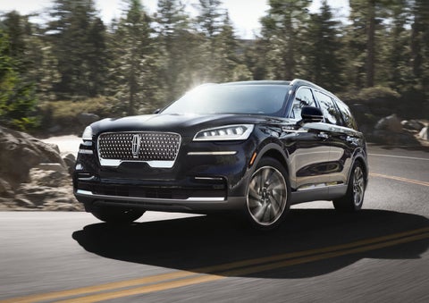 A Lincoln Aviator® SUV is being driven on a winding mountain road | West Point Lincoln of Sugar Land in Houston TX