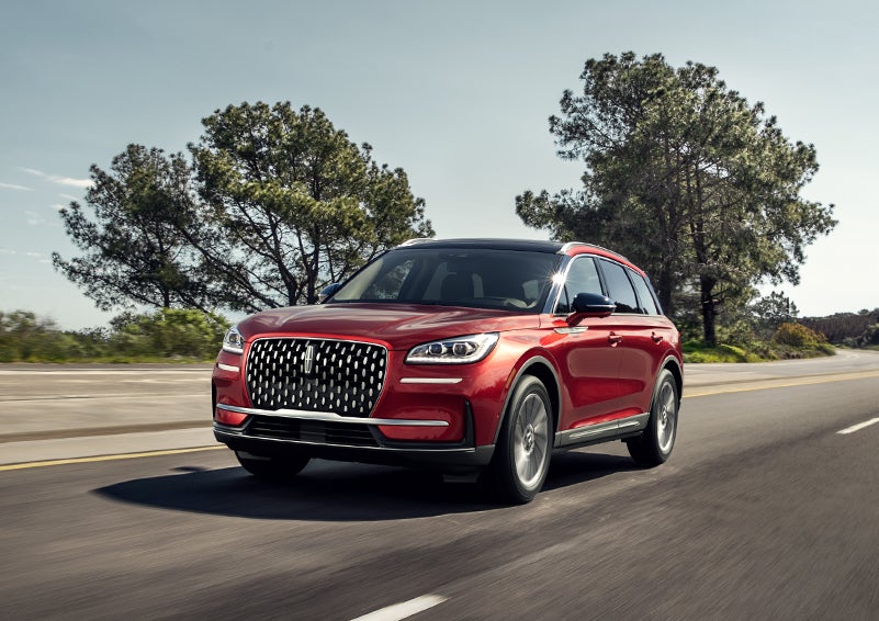 A 2024 Lincoln Corsair® SUV is shown being driven on a country road. | West Point Lincoln of Sugar Land in Houston TX